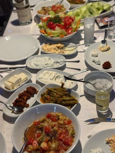 a table with many plates of food on it at Ebru'ca Pansiyon in Selimiye