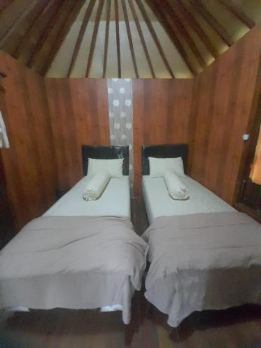 Ένα ή περισσότερα κρεβάτια σε δωμάτιο στο KLM Bungalow Lombok