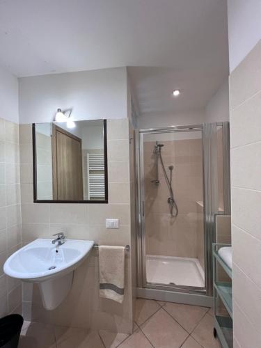 a bathroom with a sink and a shower at Villa Althea in Piombino