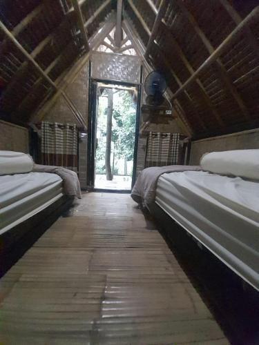 Ένα ή περισσότερα κρεβάτια σε δωμάτιο στο KLM Bungalow Lombok