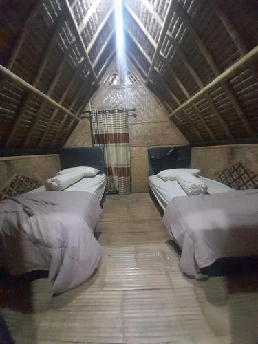 Ένα ή περισσότερα κρεβάτια σε δωμάτιο στο KLM Bungalow Lombok