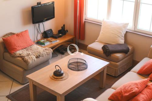 a living room with two couches and a coffee table at COC - Villa Chantoiseau in Wissant