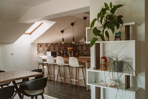 a kitchen and dining room with a table and chairs at Green Hill in Jesenice na Dolenjskem