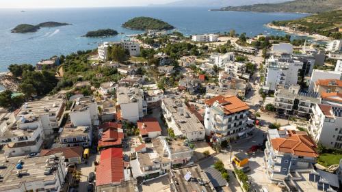 an aerial view of a city next to the ocean at Villa JIOTA in Ksamil