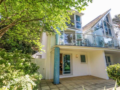 an image of a house with a balcony at 6 Red Sails in Poole