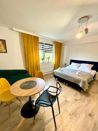 Postel nebo postele na pokoji v ubytování Madi Apartamenty