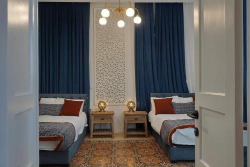 Ένα ή περισσότερα κρεβάτια σε δωμάτιο στο Oasis Palace