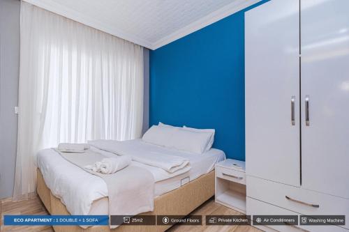 Ένα ή περισσότερα κρεβάτια σε δωμάτιο στο Antalya Residence