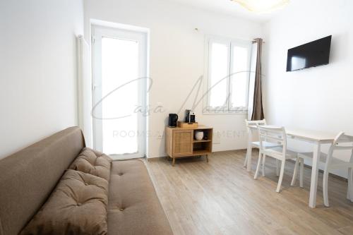 a living room with a couch and a table at Nadia Apartment in Chioggia