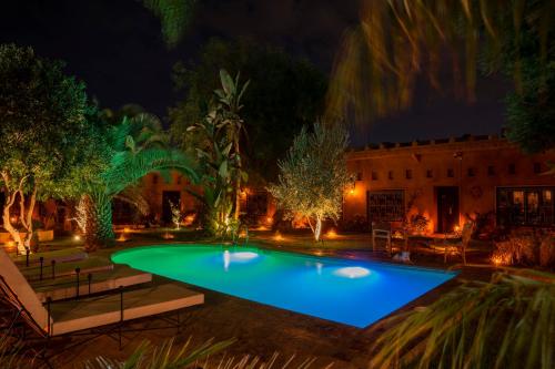 an image of a pool at night at Villa Sidi Oasis in Marrakech