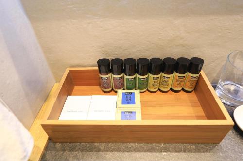 a wooden box with a row of bottles of spices at Luxury Aparthotel Zadar in Zadar