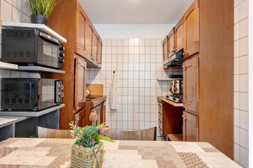 a kitchen with a table and chairs in a room at Casa Lago Leo in Omegna