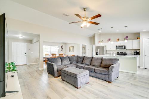 a living room with a couch and a ceiling fan at Hike, Paddle and Explore Home with Lanai in Ocala in Ocala