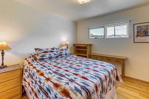 a bedroom with a bed and a window at Walk to Flathead Lake Airy Home with Mtn Views! in Polson