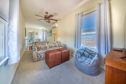 a living room with a couch and a window at Stroll Into Town Cozy Apartment in Kilmarnock in Kilmarnock