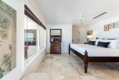 a bedroom with a bed and a window at Pease Bay House in Breakers
