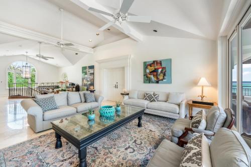 a living room with a couch and a table at Pease Bay House in Breakers