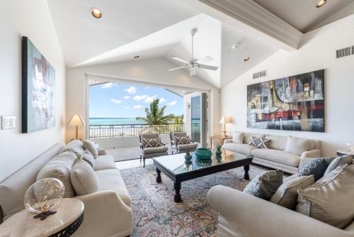 a living room with a couch and a table at Pease Bay House in Breakers