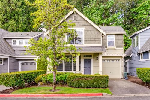a house with a tree in the front yard at 3 Mi to Dtwn Bothell Quaint Family Home with Patio in Bothell