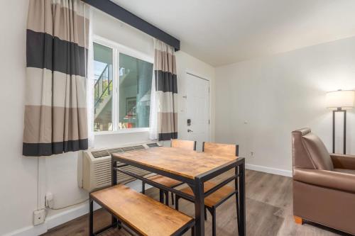 a living room with a table and a couch at Tempe Oasis in Tempe