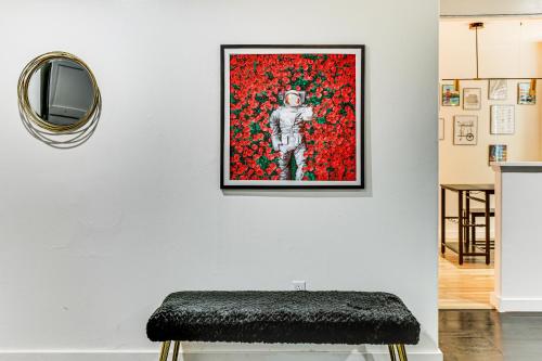 a painting of a skeleton on a wall next to a stool at 3 Mi to Emerald Downs Pet-Friendly Home in Auburn