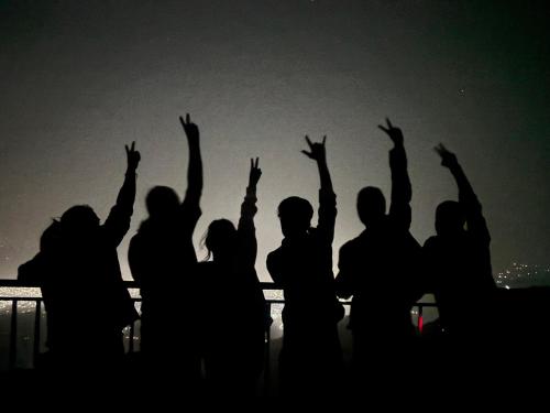 a group of people with their hands in the air at TEC Resort and bar in Dharān Bāzār