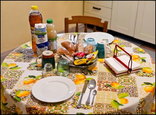 a table with a table cloth with food on it at Narnia e la Rocca di Albornoz in Narni