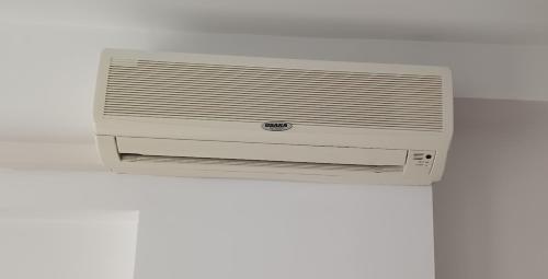 a white air conditioner sitting on top of a wall at Excelsior Prince ApartHotel in Sunny Beach