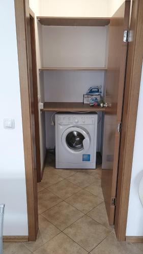 a washer and dryer in a small room at Excelsior Prince ApartHotel in Sunny Beach