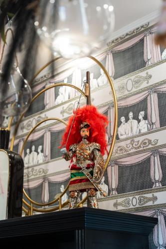 a statue of a person with a red wig at Roby's Boutique Rooms - Luxury B&B in Catania