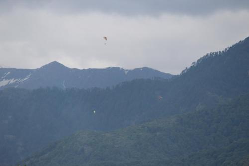 a view of a mountain range with mountains in the background at Billing View Camp and Mud Houses,Bir in Aiju
