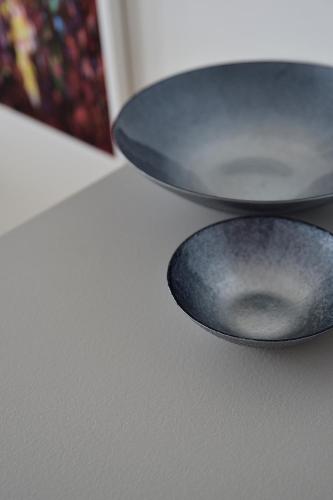 two pans sitting on top of a table at Napfény Resort by HelloBalatonlelle in Balatonlelle