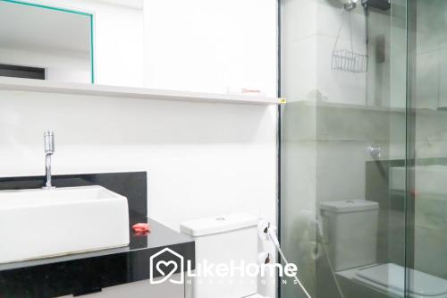 a bathroom with a sink and a toilet at Unity Cabo Branco - LikeHome Hospedagens in João Pessoa