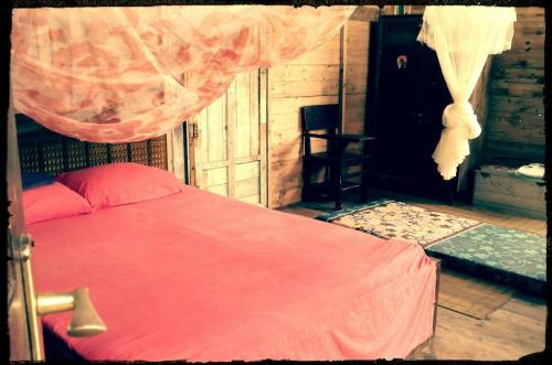 Postel nebo postele na pokoji v ubytování Sumatra Ecolodge