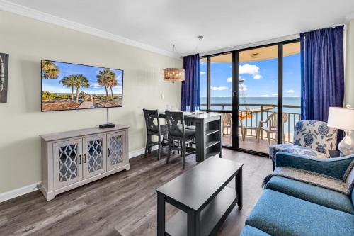 a living room with a couch and a table at Spectacular Oceanview Condos in Myrtle Beach