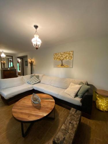 a living room with a couch and a table at Rizospito in Palaiokhóra