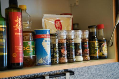 a shelf with a bunch of spices and condiments at K-HAUS in Děčín