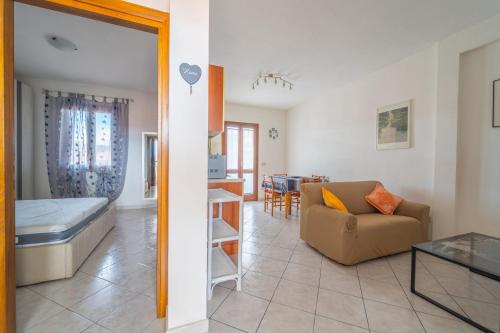 a living room with a couch and a table at casa illaria in Olbia