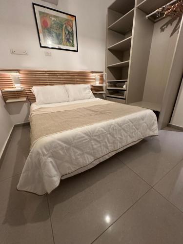 a bedroom with a large bed in a room at Sea pearl tower in Netanya