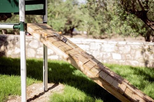 a wooden slide is attached to a street sign at Hotel Varres in Zakynthos Town