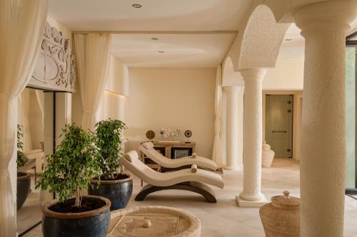 a living room with two chairs and a table at Allium Bodrum Resort & Spa in Yalıkavak