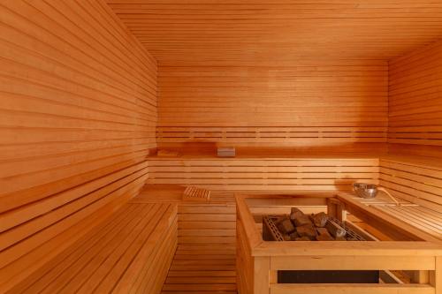 an empty wooden sauna with a bench in it at Allium Bodrum Resort & Spa in Yalıkavak
