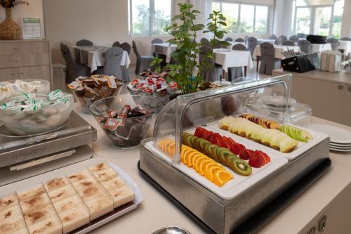 a buffet with several different types of food on a counter at Hotel Varres in Zakynthos Town