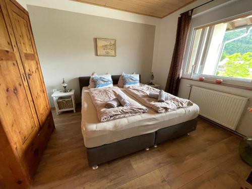 Postel nebo postele na pokoji v ubytování Seewohnung Weiss