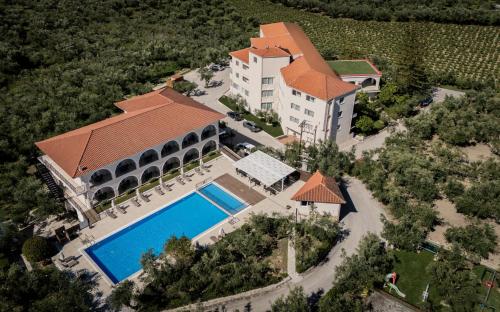 an aerial view of a house with a swimming pool at Hotel Varres in Zakynthos Town