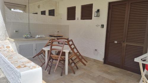 a kitchen with a table and chairs in a room at Casa Sofia in Vulcano