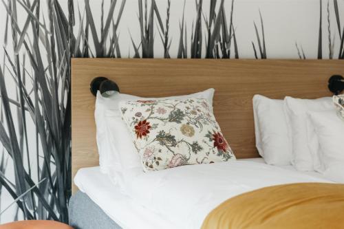 a bedroom with a bed with a pillow on it at Best Western Plus Kalmarsund Hotell in Kalmar