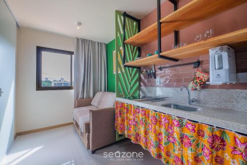 a kitchen with a sink and a counter top at Apartamentos em Prédio c/ Piscina na Ondina - SSA - HOA in Salvador