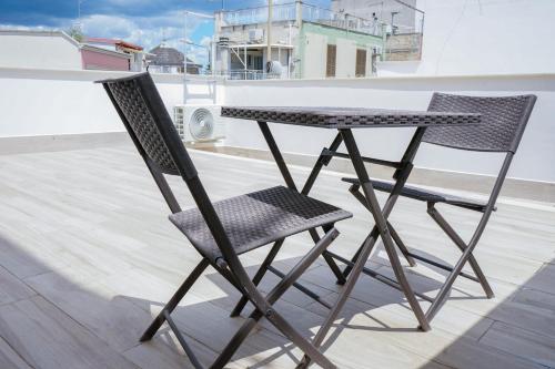 a table and two chairs sitting on a roof at Casa Vacanze San Pietro in Canosa di Puglia