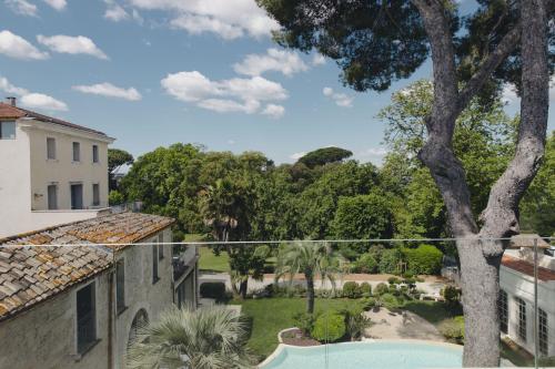a view of the garden from the balcony of a house at Domaine de Verchant & Spa - Relais & Châteaux in Montpellier